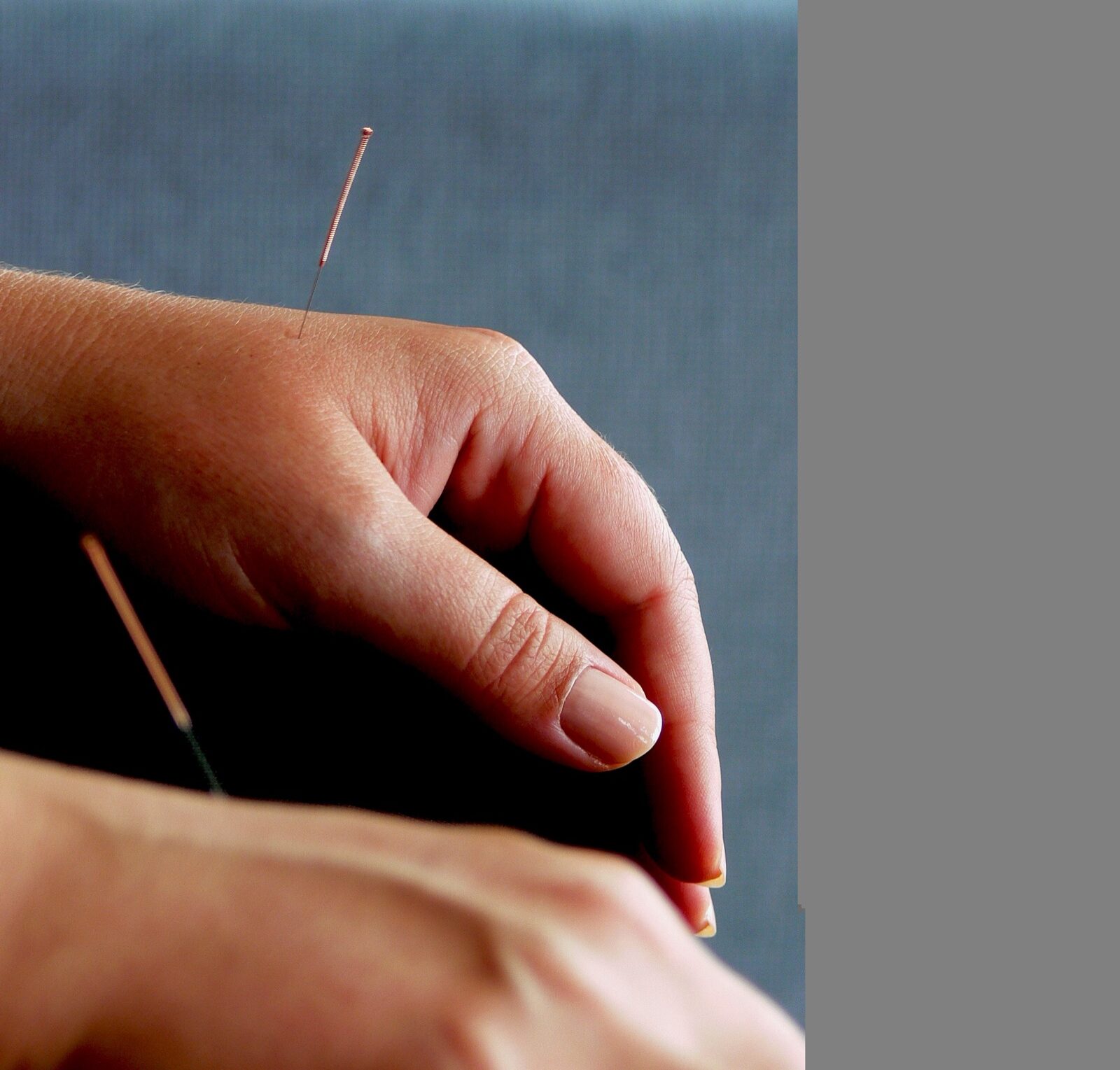 Close-up of a fine needle inserted just under the skin, the shared visual both treatments share