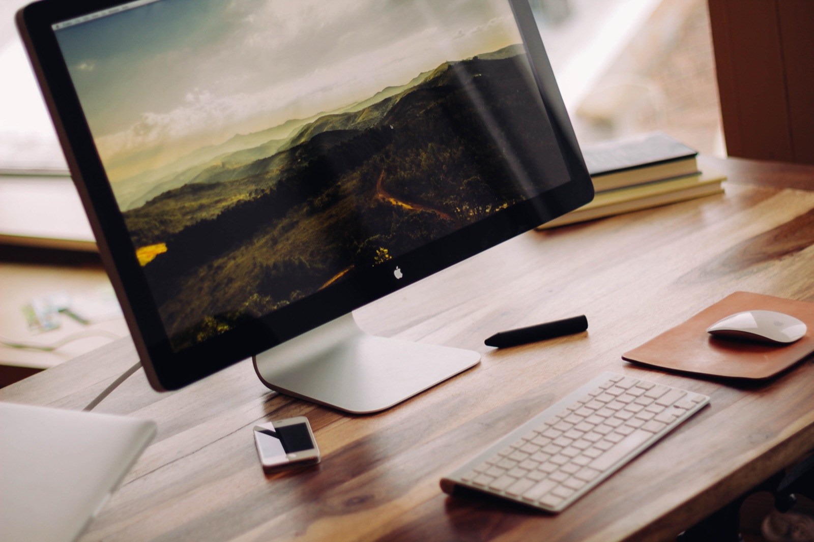 Desk workstation with monitor, keyboard and mouse positioned for an ergonomic setup
